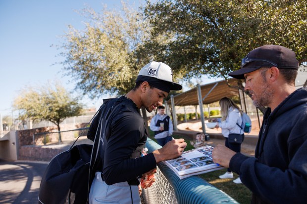 Chicago White Sox outfielder Braden Montgomery signs autographs during spring training at Camelback Ranch Saturday Feb. 15, 2025, in Glendale, Ariz.(Armando L. Sanchez/Chicago Tribune)