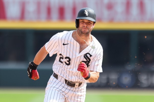 Chicago White Sox outfielder Andrew Benintendi (23) runs to third base on a double from Chicago White Sox outfielder Luis Robert Jr. (88) in the eighth inning against the Cleveland Guardians at Rate Field on Sunday, July 13, 2025. (Eileen T. Meslar/Chicago Tribune)