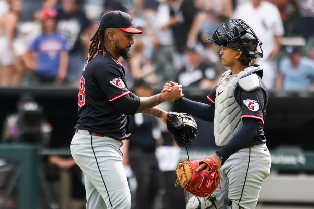 Cleveland Guardians pitcher Emmanuel Clase (48) celebrates with catcher Bo Naylor (23) after defeating the Chicago White Sox 6-5 at Rate Field on Sunday, July 13, 2025. (Eileen T. Meslar/Chicago Tribune)
