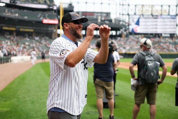 Former Chicago White Sox pitcher Mark Buehrle laughs as he plays catch before the game against the Cleveland Guardians at Rate Field on Sunday, July 13, 2025. (Eileen T. Meslar/Chicago Tribune)