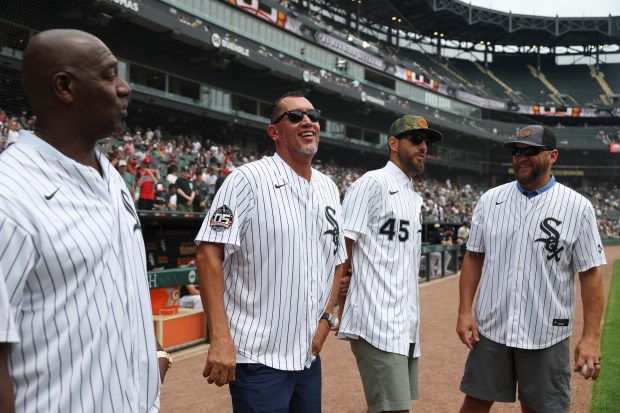 Former Chicago White Sox pitchers José Contreras, from left, Freddy García, Jon Garland, and Mark Buehrle wait to throw out the first pitch together before the game against the Cleveland Guardians at Rate Field on Sunday, July 13, 2025. (Eileen T. Meslar/Chicago Tribune)