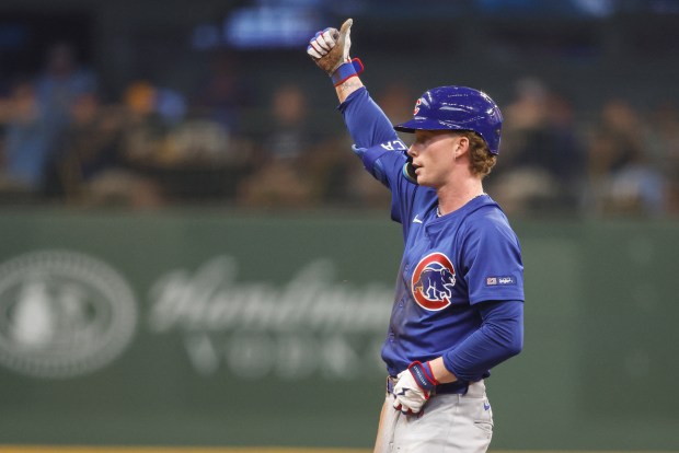 Chicago Cubs' Pete Crow-Armstrong reacts after hitting a run scoring double against the Milwaukee Brewers during the third inning of a baseball game, Wednesday, July 30, 2025, in Milwaukee. (AP Photo/Jeffrey Phelps)