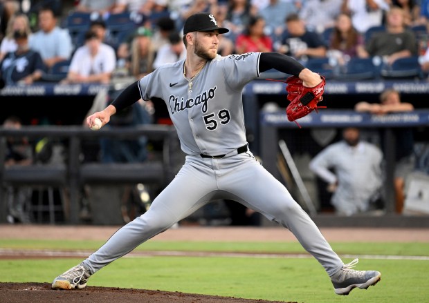 Chicago White Sox pitcher Sean Burke throws during the first inning of a baseball game against the Tampa Bay Rays, Monday, July 21, 2025, in Tampa, Fla. (AP Photo/Jason Behnken)