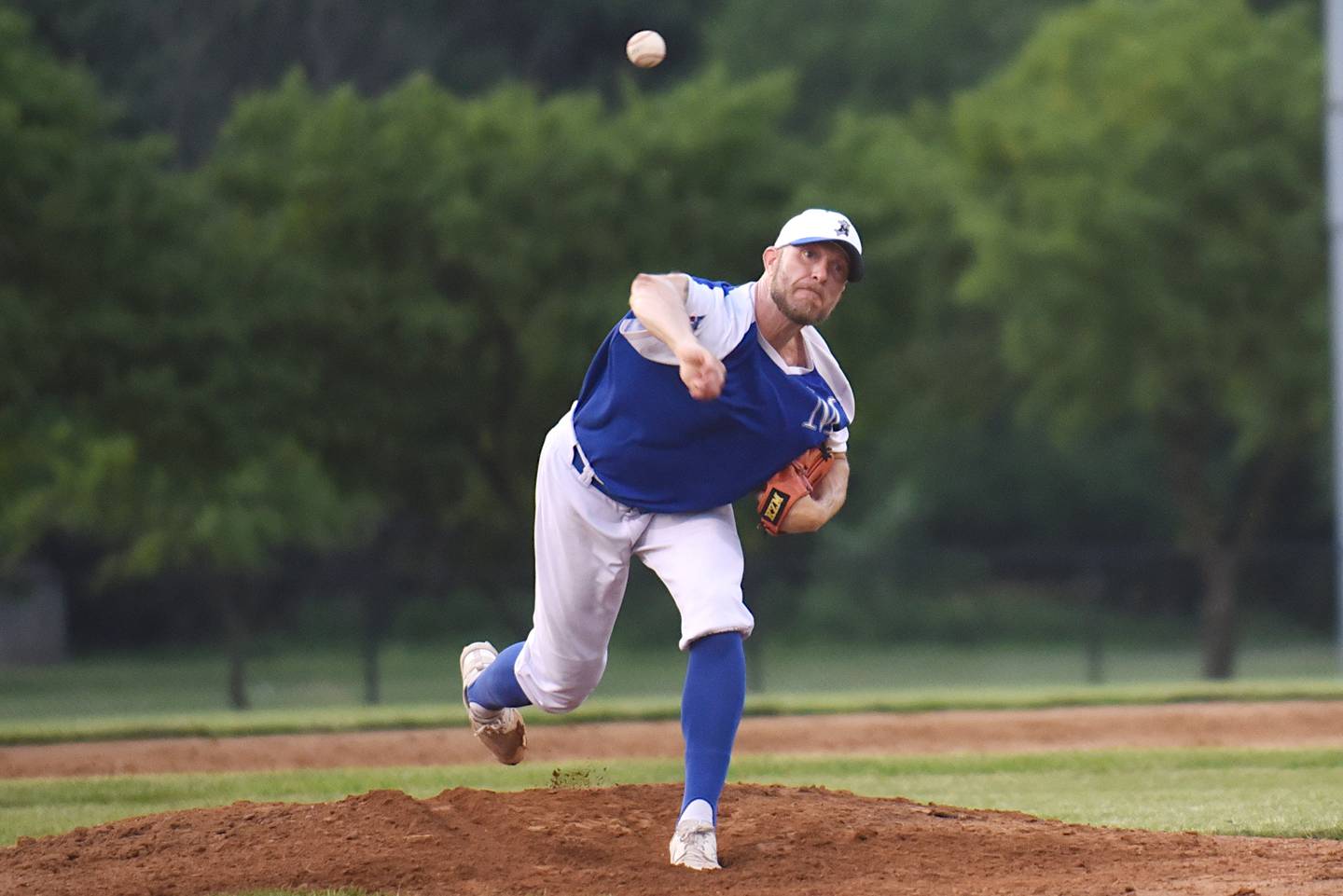 Beecher Muskies' Kris Honel throws a pitch against the Lombard Orioles during a Chicago Suburban Baseball League game at Gouwens Park in South Holland last month.