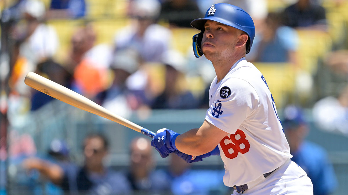Los Angeles Dodgers catcher Dalton Rushing (68) hits an RBI double against the Houston Astros during the second inning of the game at Dodger Stadium.