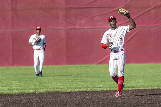 Homewood-Flossmoor's Shai Robinson catches an infield fly ball while playing shortstop against Crete-Monee during a nonconference game in Flossmoor on Friday, May 13, 2022.