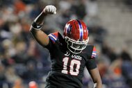 Duncanville defensive end Kevin "KJ" Ford Jr. celebrates a sack during second-quarter action...