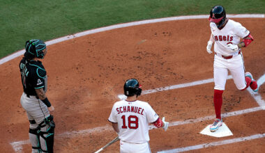 Zach Neto #9 of the Los Angeles Angels after hitting a home run against the Arizona Diamondbacks in...