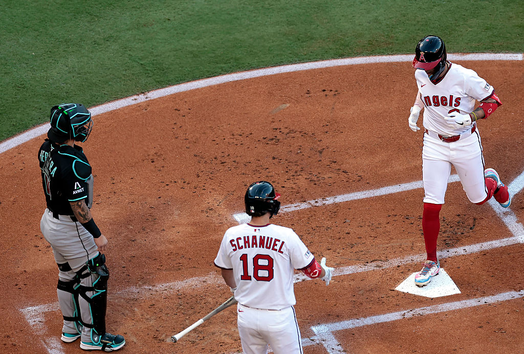 Zach Neto #9 of the Los Angeles Angels after hitting a home run against the Arizona Diamondbacks in...