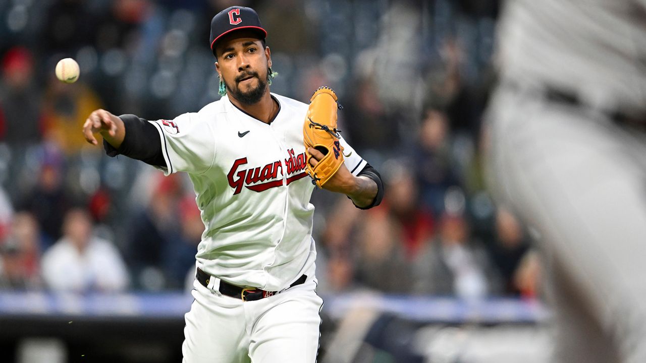 Cleveland Guardians relief pitcher Emmanuel Clase throws out Detroit Tigers' Jake Rogers at first base during the ninth inning of a baseball game, Tuesday, May 9, 2023, in Cleveland. (AP Photo/Nick Cammett)