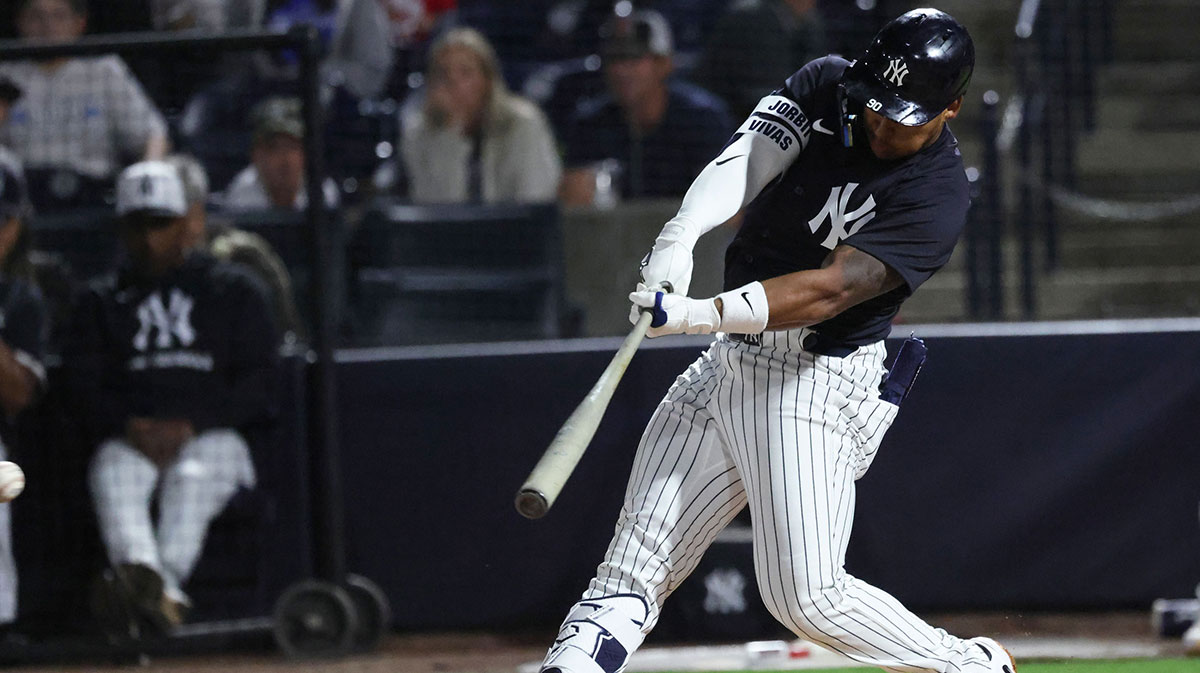 New York Yankees second base Jorbit Vivas (90) hits a single during the second inning against the Toronto Blue Jays at George M. Steinbrenner Field.