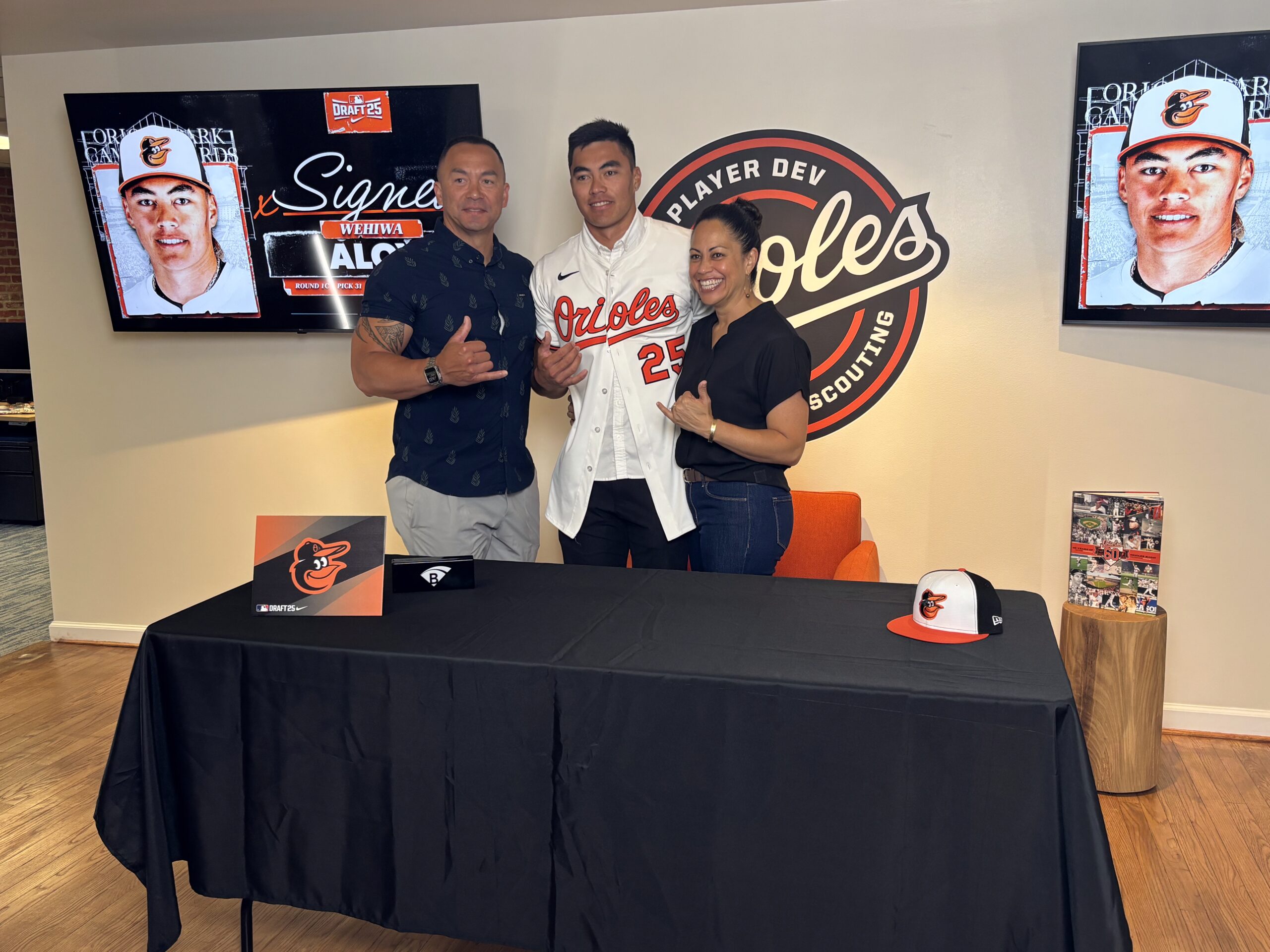 Wehiwa Aloy, the first first-round Major League Baseball draft choice ever from Maui, is joined by his father Jamie Aloy and mother Napua Aloy on Saturday at Oriole Park at Camden Yards. Baltimore Orioles photo