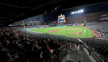 Why did the Orioles and Rockies keep playing after fans evacuated seats?