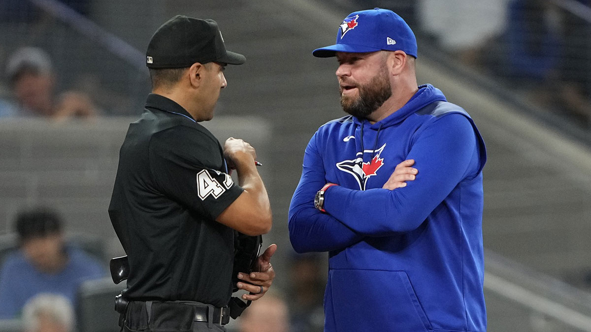 Toronto Blue Jays manager John Schneider talks to home plate umpire Gabe Morales after calling out Toronto Blue Jays first baseman Vladimir Guerrero (not pictured) on strikes during the eighth inning against the New York Yankees at Rogers Centre. 