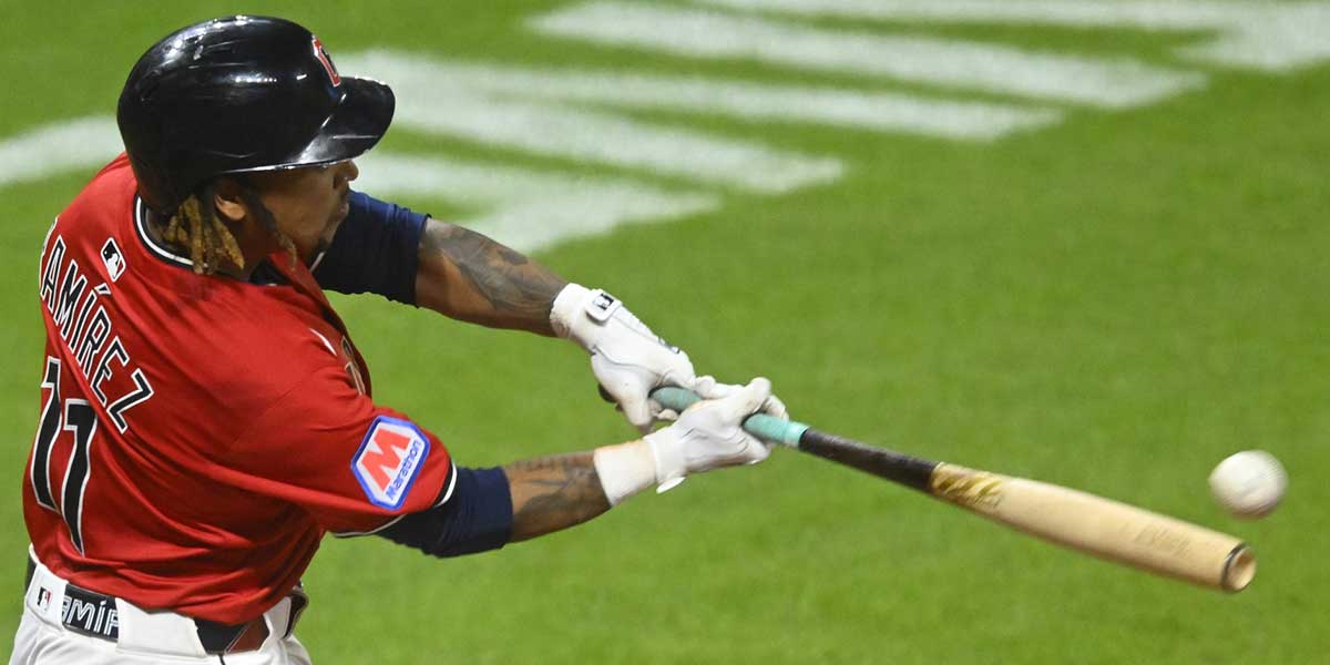 Jun 25, 2025; Cleveland, Ohio, USA; Cleveland Guardians third baseman Jose Ramirez (11) hits a game-winning RBI single in the tenth inning against the Toronto Blue Jays at Progressive Field. 