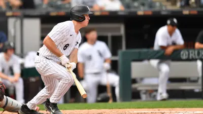 Jul 12, 2025; Chicago, Illinois, USA; Chicago White Sox catcher Kyle Teel (8) hits a two-run single during the fourth inning against the Cleveland Guardians at Rate Field.