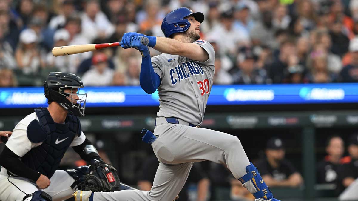 Jun 6, 2025; Detroit, Michigan, USA; Chicago Cubs right fielder Kyle Tucker (30) hits an RBI double against the Detroit Tigers in the sixth inning at Comerica Park. 
