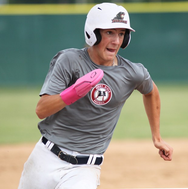 A Rocky River runner advances to third against Amherst at...
