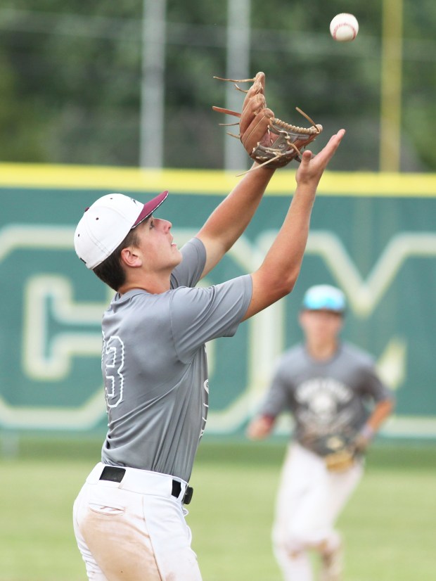 A Rocky River infielder makes the catch on a pop...