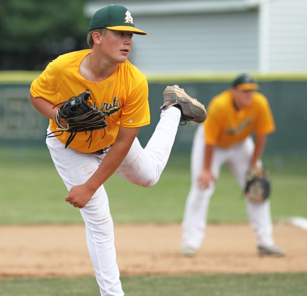 Chael Schneider of Amherst delivers a first inning pitch against...