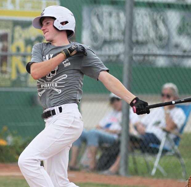 Rocky River's Elliott Millin delivers a base hit against Amherst...