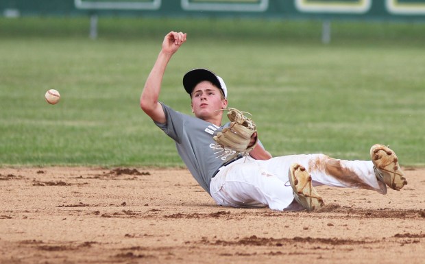 The ball gets by a Rocky River infielder after he...