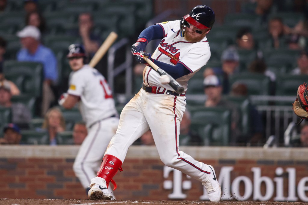Atlanta Braves left fielder Alex Verdugo (8) hits a single against the Arizona Diamondbacks in the eighth inning at Truist Park.
