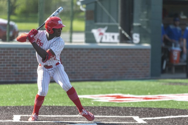 Homewood-Flossmoor's Shai Robinson steps forward for a swing against Crete-Monee during a nonconference game in Flossmoor on Friday, May 13, 2022.