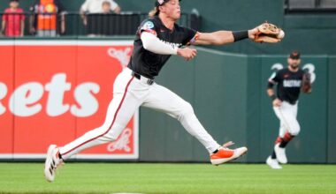 Lighting forces fans to leave their seats, but the Orioles and Rockies play on