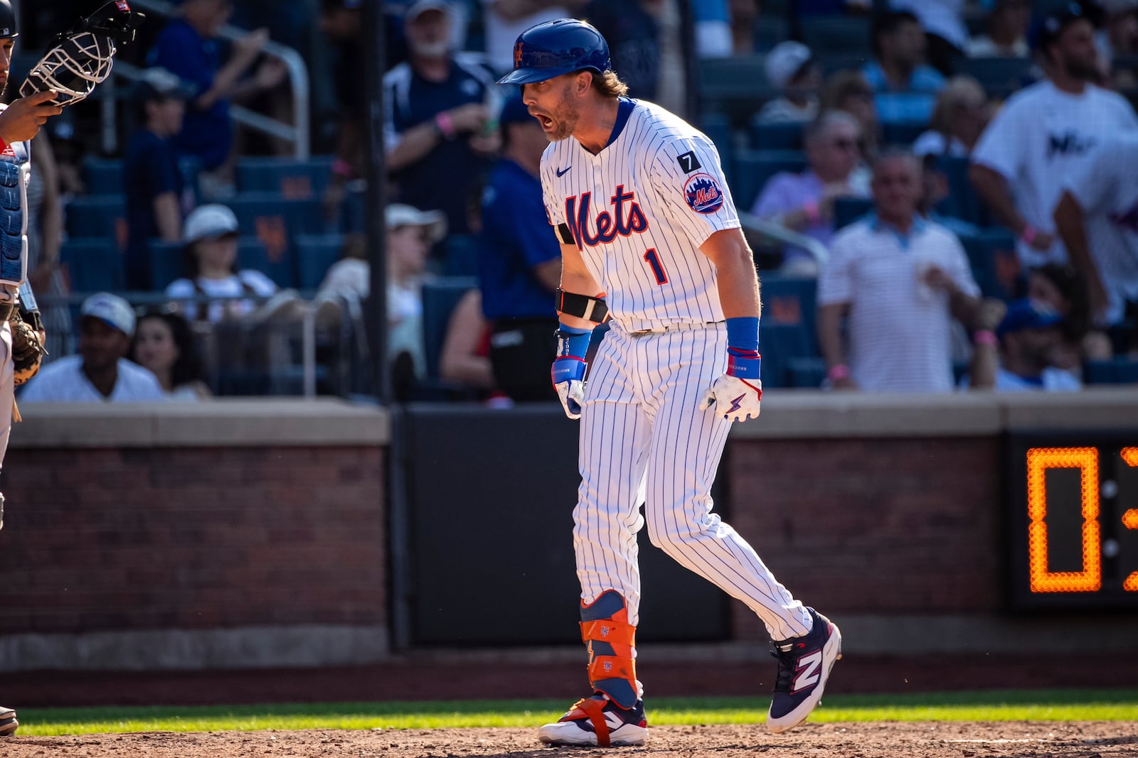 New York Mets' Jeff McNeil celebrates after scoring on his two-run during the seventh inning of a baseball game against the New York Yankees, Friday, July 4, 2025, in New York. (AP Photo/Angelina Katsanis)