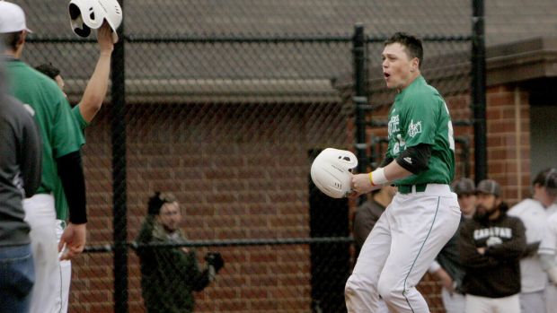Providence's Dakota Kotowski celebrates at home plate after scoring during Saturday's game against Mount Carmel.