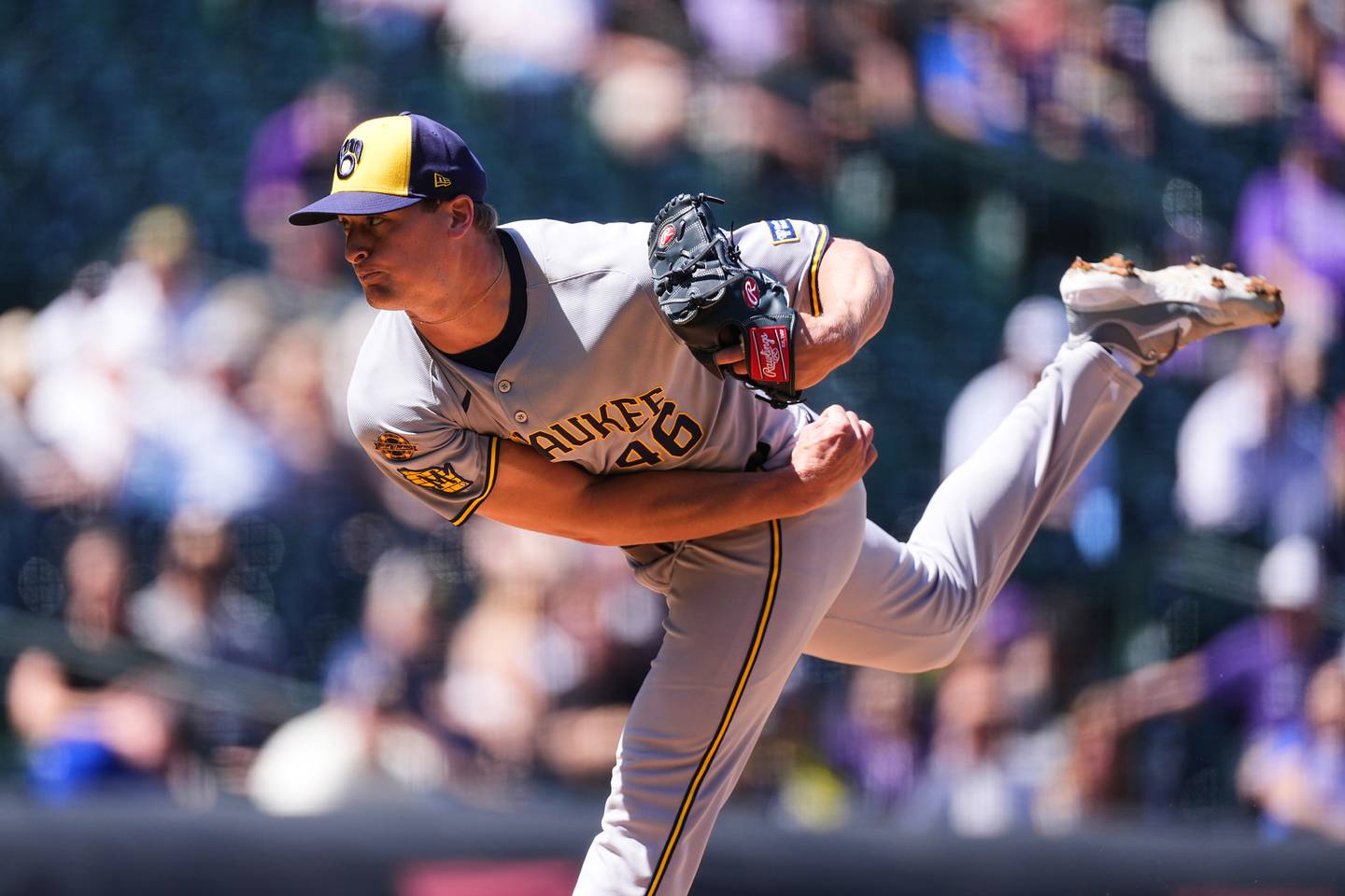 Milwaukee Brewers starting pitcher Quinn Priester works against the Colorado Rockies in the first inning of a baseball game Thursday, April 10, 2025, in Denver. (AP Photo/David Zalubowski)