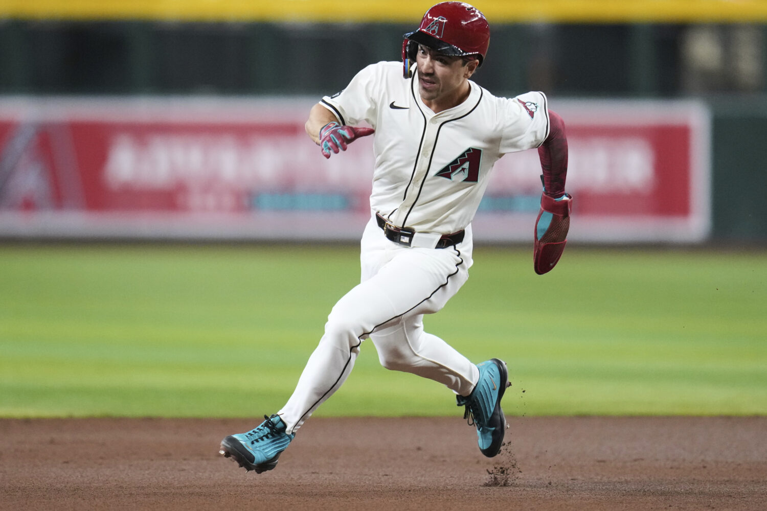 Arizona Diamondbacks' Corbin Carroll advances to third base on a single by Diamondbacks' Geraldo Pe...