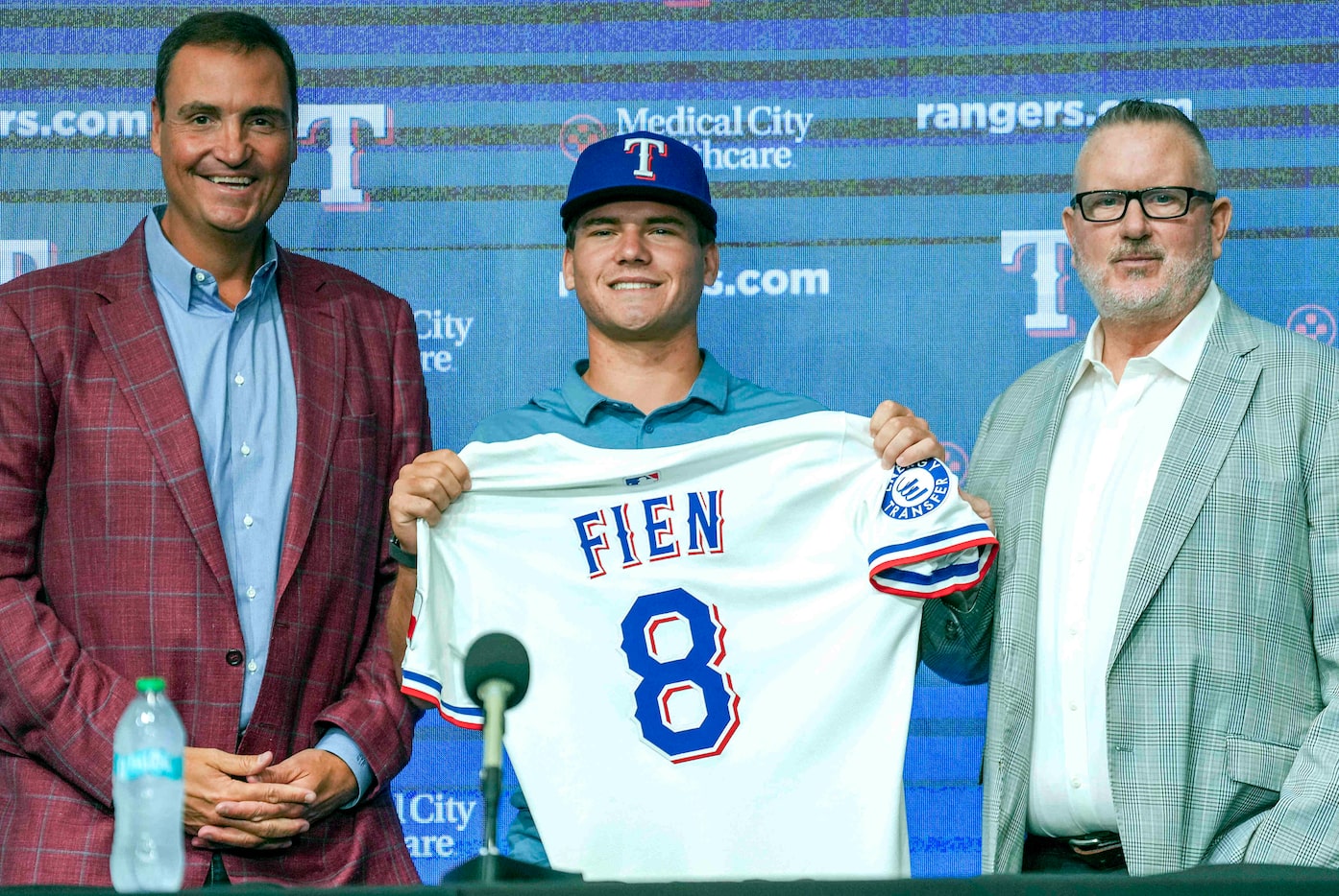 Texas Rangers first-round pick Gavin Fien poses for a photo with president of baseball...