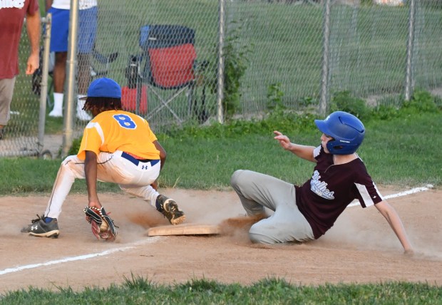 Phillies Nate Marano slides safely into third. (Photo by Rick...