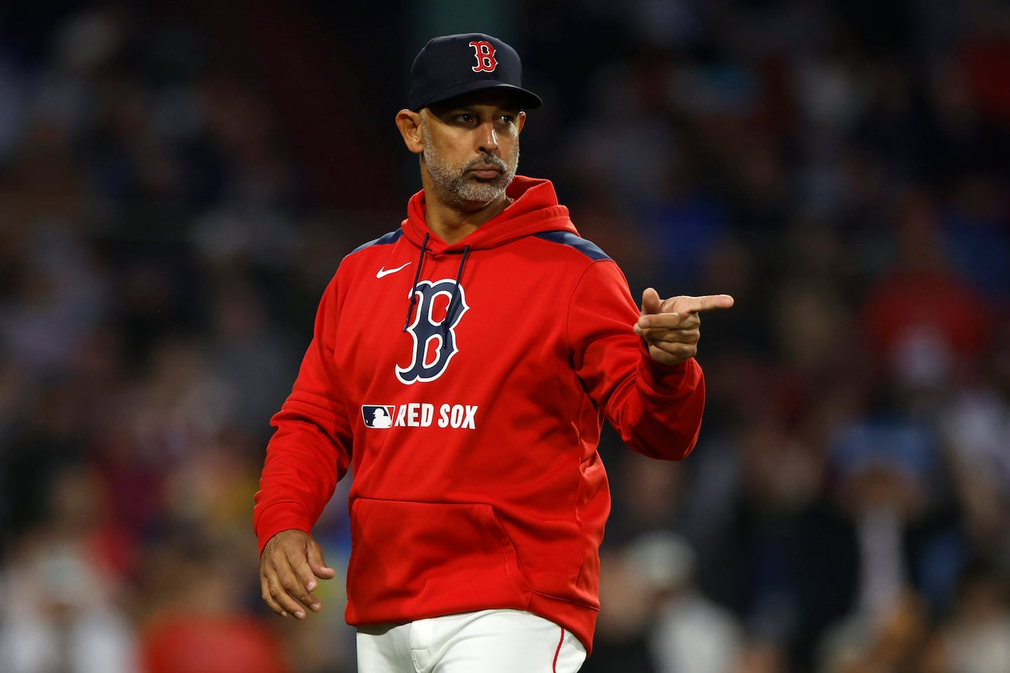 Alex Cora's family surprised him on the field on Wednesday.