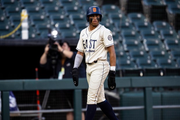 Oswego's Kamrin Jenkins (13) takes a lead off of third base during the Double Duty Classic at Rate Field in Chicago on Wednesday, July 2, 2025. (Vincent D. Johnson / for the Daily Southtown)