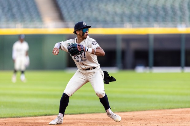 Oswego's Kamrin Jenkins (13) throws a ball to first during the Double Duty Classic at Rate Field in Chicago on Wednesday, July 2, 2025. (Vincent D. Johnson / for the Daily Southtown)