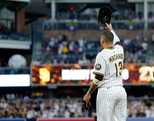Manny Machado #13 of the San Diego Padres waves to the crowd after hitting his 2,000th career hit in the fourth inning against the Arizona Diamondbacks at Petco Park on July 7, 2025 in San Diego, California. (Photo by K.C. Alfred / The San Diego Union-Tribune via Getty Images)