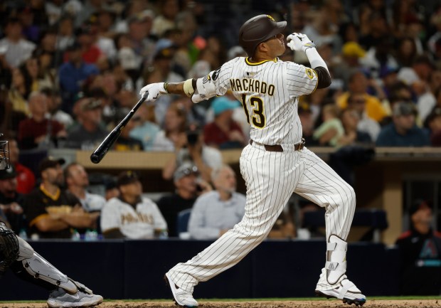 Manny Machado #13 of the San Diego Padres hits a solo home run in the eighth inning against the Arizona Diamondbacks at Petco Park on July 7, 2025 in San Diego, California. (Photo by K.C. Alfred / The San Diego Union-Tribune)
