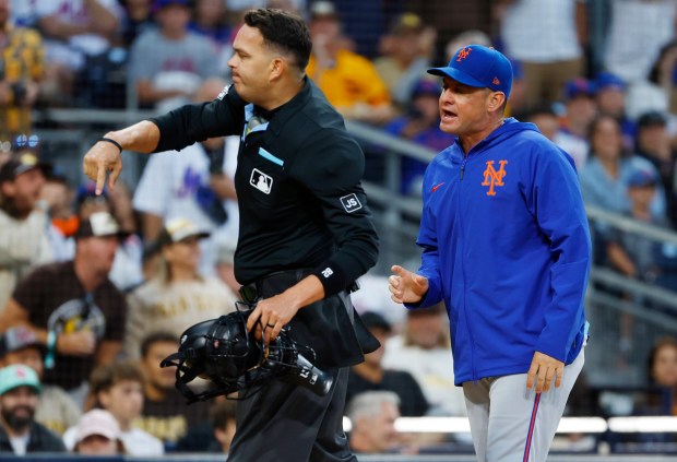 New York Mets manager Carlos Mendoza #64 argues is thrown out of the game by umpire Emil Jimenez #82 during the third inning at Petco Park on July 28, 2025 in San Diego, California. (K.C. Alfred / The San Diego Union-Tribune)