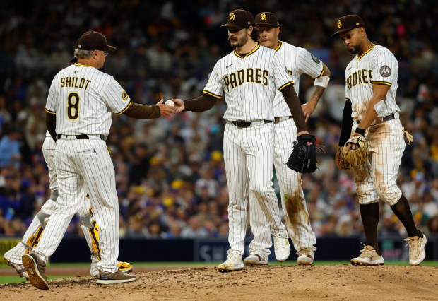 Dylan Cease #84 of the San Diego Padres is pulled from the game by manager Mike Shildt #8 after giving up a grand slam to Mark Vientos #27 of the New York Mets in the fifth inning at Petco Park on July 28, 2025 in San Diego, California. (K.C. Alfred / The San Diego Union-Tribune)