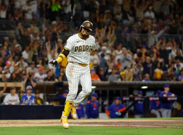 Luis Arraez #4 of the San Diego Padres flips his bat after hitting a two-run home run against the New York Mets in the fifth inning at Petco Park on July 28, 2025 in San Diego, California. (K.C. Alfred / The San Diego Union-Tribune)