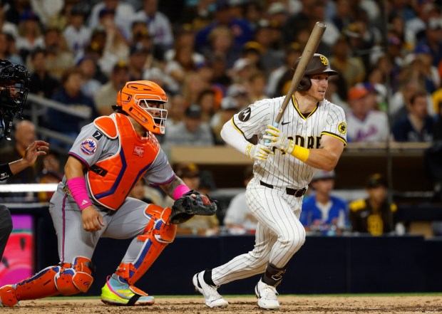 Bryce Johnson #29 of the San Diego Padres hits a RBI single against the New York Mets in the fifth inning at Petco Park on July 28, 2025 in San Diego, California. (K.C. Alfred / The San Diego Union-Tribune)