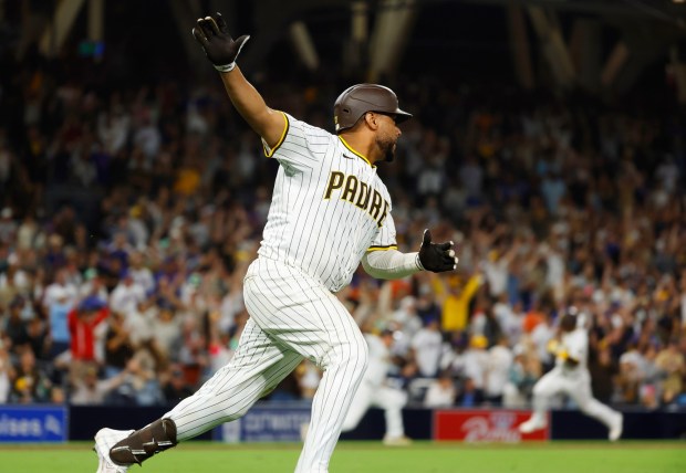 Elias Díaz #17 of the San Diego Padres celebrates a hitting walk off single in the ninth inning to beat the New York Mets 7-6 at Petco Park on July 28, 2025 in San Diego, California. (K.C. Alfred / The San Diego Union-Tribune)