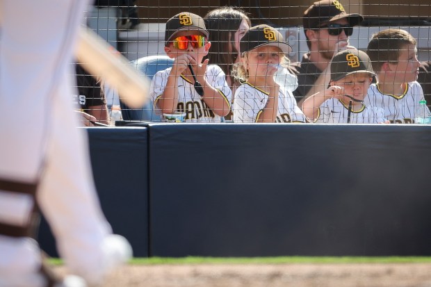 Young San Diego Padres fans watch the fifth inning against the Texas Rangers at Petco Park on Friday, July 4, 2025 in San Diego, CA. (Meg McLaughlin / The San Diego Union-Tribune)