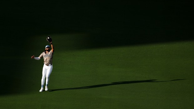 Fernando Tatis Jr. #23 of the San Diego Padres catches Kyle Higashioka #11 of the Texas Rangers fly ball during the ninth inning at Petco Park on Friday, July 4, 2025 in San Diego, CA. (Meg McLaughlin / The San Diego Union-Tribune)
