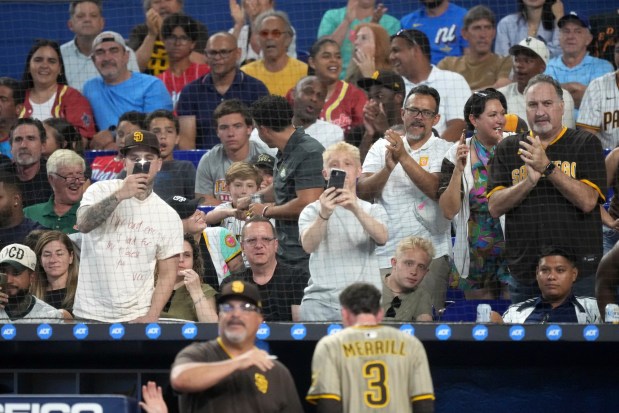 San Diego Padres fans cheer as Jackson Merrill returns to the dugout after scoring on a double by San Diego Padres MartÃ­n Maldonado, in the second inning of a baseball game against the Miami Marlins, Monday, July 21, 2025, in Miami. (AP Photo/Rebecca Blackwell)