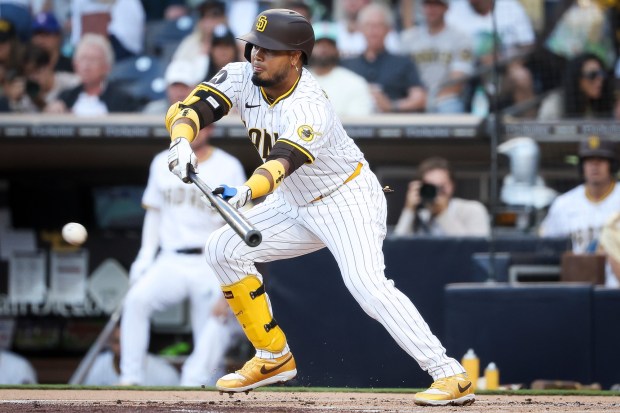 Luis Arraez #4 of the San Diego Padres bunts against the New York Mets during the first inning at Petco Park on Tuesday, July 29, 2025 in San Diego, CA. (Meg McLaughlin / The San Diego Union-Tribune)