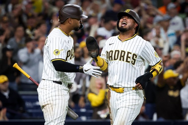 Xander Bogaerts #2 of the San Diego Padres and Luis Arraez #4 celebrate after Arraez scored a run against the New York Mets during the sixth inning at Petco Park on Tuesday, July 29, 2025 in San Diego, CA. (Meg McLaughlin / The San Diego Union-Tribune via Getty Images)